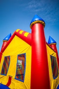 Bounce House Blown onto Highway with Child Inside 